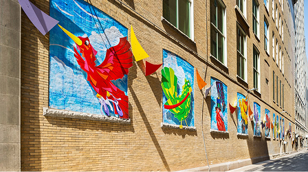 Colorful mural on the exterior wall of The Academy building.